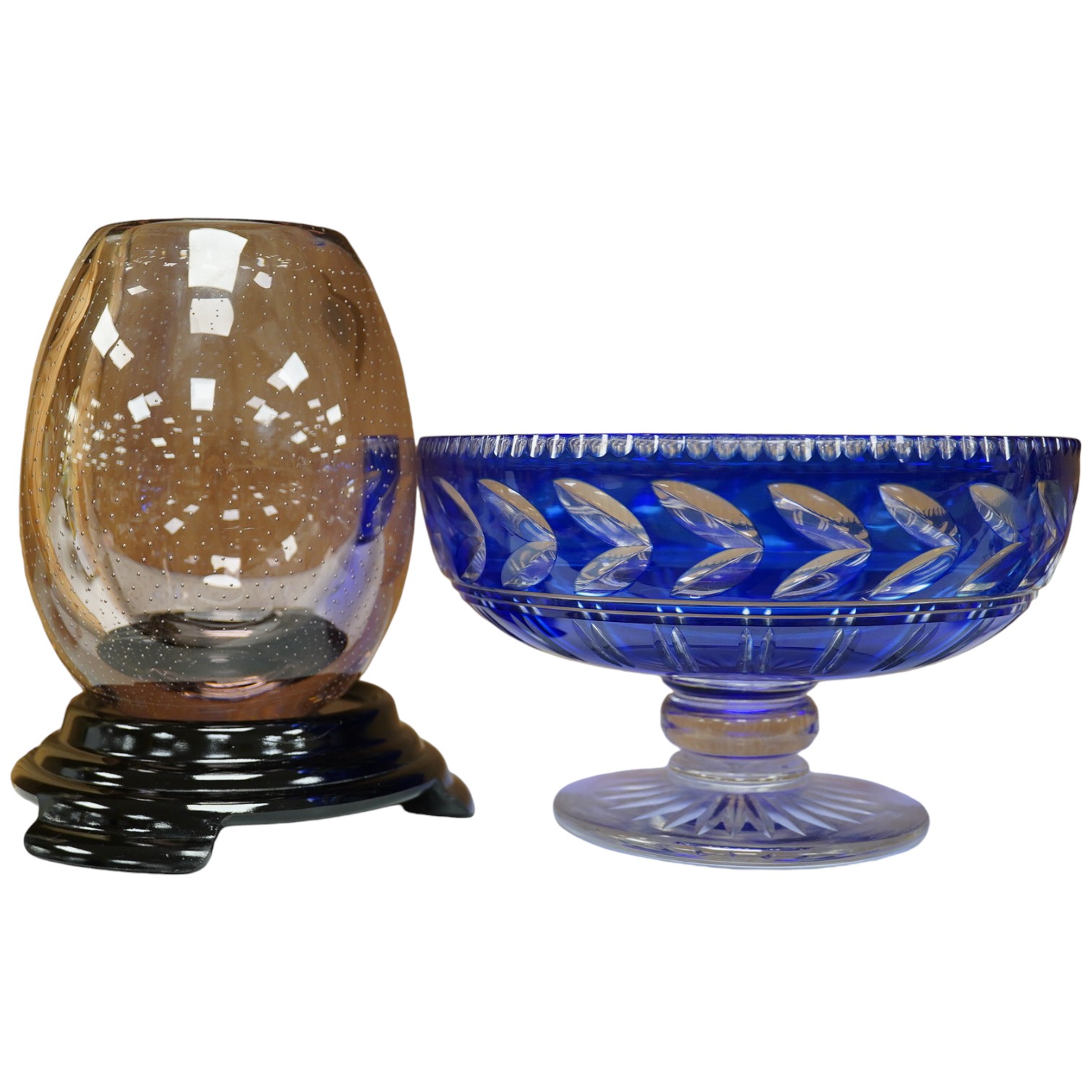 A Whitefriars amethyst ovoid vase on stand and a blue overlaid fruit bowl, vase on stand 20.5cm high. Condition - Whitefriars good, overlaid bowl interior base scratched